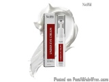 The image shows a product from the brand Nidhi. It is a white tube with a red label that reads "Under Eye Cream". The tube is...