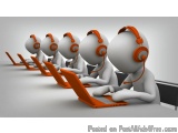 The image shows a group of 3D characters sitting at a long table with laptops in front of them. They are all wearing orange h...