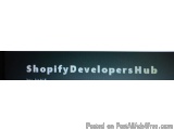 The image is a black rectangular label with white text that reads "Shopify Developers Hub". The text is in all caps and is ce...