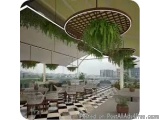 The image shows a modern outdoor dining area with a view of the city. The room has a high ceiling with a circular pendant lig...