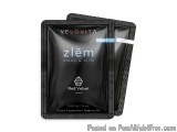 The image shows a black packet of Velovita Zlem Red Velvet. The packet is rectangular in shape and has a flap on top. The fro...