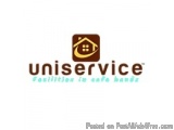 The image is a logo for a company called Uniservice. The logo is rectangular in shape and has a brown background. In the cent...