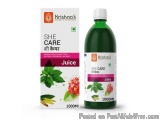 The image shows a bottle of Krishna's She Care Juice. The bottle is green in color and has a white cap. The label on the bott...