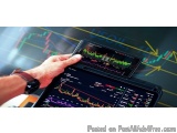 The image shows a person's hand holding a smartphone and a tablet with a stock market chart on the screen. The chart is in th...