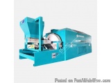 The image shows a blue-colored industrial machine, which appears to be a type of woodworking machine. It has a cylindrical sh...