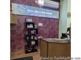 The image shows the reception area of Dr. Aishwarya B.D.S. M.D., Gold Medalist Multispeciality Dental Care. The reception des...