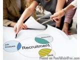 The image shows a group of people sitting around a table with a white paper in the center. On the paper, there is a Venn diag...