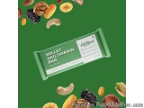 The image is an advertisement for a Millet Multigrain Bar. The bar is in the center of the image and is a green wrapper with...