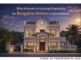 The image shows a beautiful two-story house with a grand entrance. The house is located in Ahmedabad, India, as indicated by...