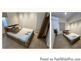 The image shows two photographs of a bedroom with a single bed in the center. The bed is made up with a wooden frame and a bl...
