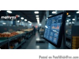The image shows a large black tablet computer mounted on a pole in a supermarket aisle. The tablet screen displays various gr...