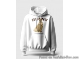 The image is of a white hoodie with a graphic design on the front. The design features a brown bunny sitting on its hind legs...