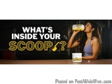 The image shows a young woman sitting at a table and drinking from a yellow scoop. She is wearing a purple tank top and has l...
