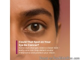 The image is a close-up of a person's eye. The eye is brown and appears to be healthy and well-groomed. The person's eyebrow...