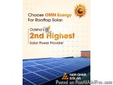 The image shows a rooftop solar panel installation. The panel is arranged in a grid-like pattern and is blue in color. The ba...