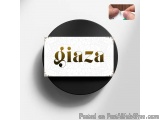 The image is a circular logo with a black background and a white background. In the center of the logo, there is a text that...