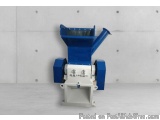 The image shows a blue-colored industrial machine, which appears to be a type of wood pellet making machine. It has a cylindr...