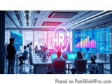 The image shows a modern office space with a large window on the right side. The room is filled with desks and chairs, and th...