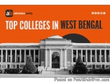 The image is a black and white photograph of a large building with a dome on top. The building appears to be a college or uni...
