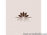 The image is a logo for a spa called "Ziara Spa by Revera". The logo is a simple design with a brown color scheme. In the cen...