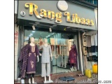 The image shows the entrance of a clothing store named "Rang Libaaas". The store has a large sign above the entrance with the...
