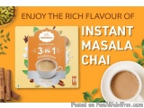 The image is an advertisement for a product called "Namaste 3-in-1 Masala Chai". The background of the image is orange, and t...
