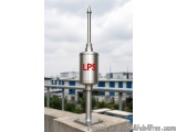 The image shows a cylindrical metal object with the letters "LPS" written on it in red. The object appears to be a thermomete...