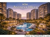 The image is an aerial view of a luxurious resort named M3M Antalya Hills. The resort is located in a high-rise building comp...