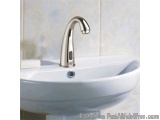 The image shows a modern bathroom sink with a white countertop and a silver faucet. The sink is made of ceramic and has a rou...