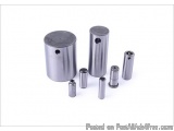 The image shows a set of six cylindrical metal objects, which appear to be bearings or shafts. The objects are made of stainl...