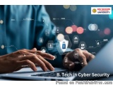 The image shows a person's hands typing on a laptop keyboard. The background is blurred, but it appears to be a desk or a tab...