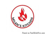 The image is a logo for Milan's Kitchen. It is a circular logo with a red background and a white border. In the center of the...