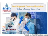 The image shows two scientists working in a laboratory. They are both wearing white lab coats, masks, and gloves. The scienti...