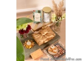 The image shows a flat lay of a table setting with a variety of items on it. On the left side of the table, there is a vase w...