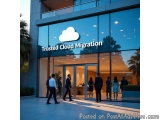 The image shows the entrance of a building with a large glass window that reads "Trusted Cloud Migration". The building is su...