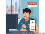 The image shows a young man sitting at a desk in front of a computer monitor. He is holding a smartphone with the text "Remov...