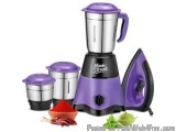 The image shows a purple and black electric blender with a purple lid. The blender has a sleek and modern design with a black...