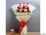 The image is of a beautiful bouquet of red roses wrapped in white tissue paper. The roses are arranged in a neat and orderly...