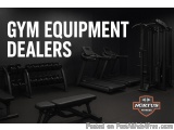 The image shows a gym with various exercise equipment. There are two treadmills, a weight bench, and a rack of dumbbells. The...