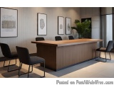 The image shows a modern office reception area with a large wooden desk in the center. The desk is made of light-colored wood...