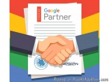 The image is an illustration of two hands shaking over a document with the text "Google Partner" and "Premier" on it. The doc...
