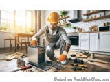 In this image, we can see a man wearing a yellow hard hat and overalls, kneeling on the floor in a kitchen. He is holding a t...