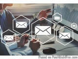 The image shows a person sitting at a desk with a computer and a keyboard in front of them. The person is holding a pen and a...