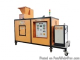 The image shows a control panel of a machine. The machine is orange in color and has a rectangular shape with a lid on top. I...
