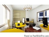 The image shows a modern office space with a yellow desk and two computer monitors on the desk. The desk is in the center of...