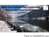 The image shows a beautiful landscape of a mountainous area with a lake in the foreground. The lake is surrounded by snow-cov...