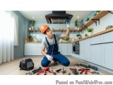 In this image, we can see a young man wearing an orange hard hat and blue overalls, kneeling on the floor in a kitchen. He is...