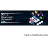 The image is an illustration of a website development company in Delhi. It shows a person sitting at a desk with a computer m...