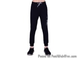 The image shows a person wearing black sweatpants with a white logo on the left leg. The sweatpants have a drawstring waistba...