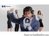 The image shows a man in a suit holding a megaphone and shouting into it. He has a serious expression on his face and his rig...